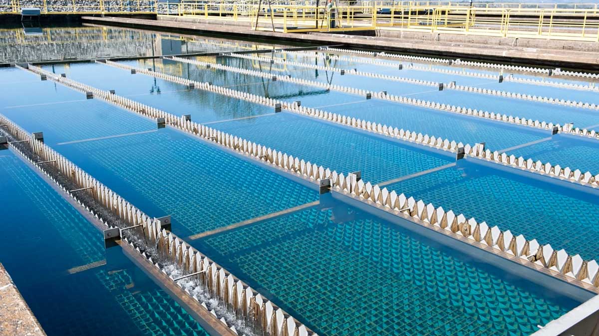 Water treatment basin with clear water flowing through structured filter panels at Eastside Utility District&rsquo;s facility